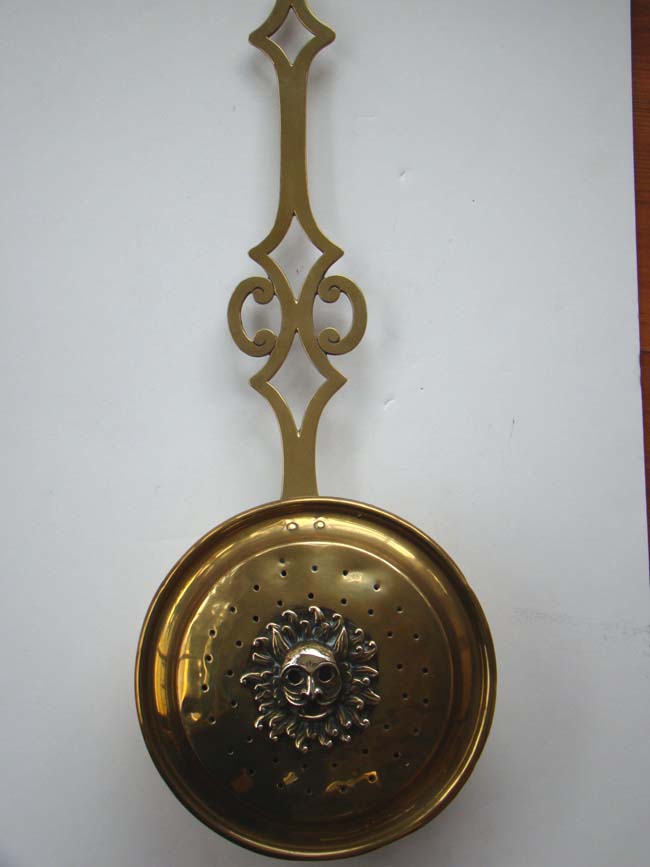 An English brass Chestnut warming pan with lion head decoration circa 1790-1820